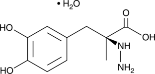 A dopamine decarboxylase inhibitor; inhibits conversion of L-DOPA to dopamine in the periphery; increases the plasma concentration of L-DOPA by 186% and prolongs the half-life in plasma by 48% and skeletal muscle extracellular fluid by 66% in dog when administered at a dose of 100 mg/kg; potentiates the activity of AhR; inhibits proliferation of pancreatic cancer cells  in vitro and tumor growth in vivo